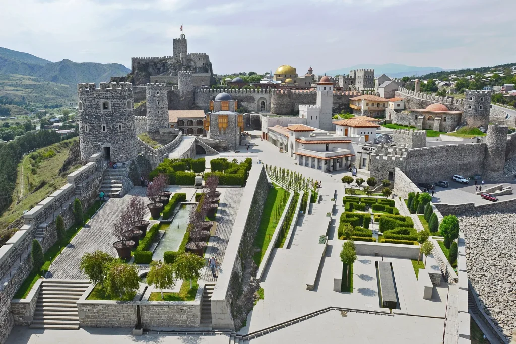 Aerial view of Rabati Castle in Akhaltsikhe showing its restored towers and manicured gardens.