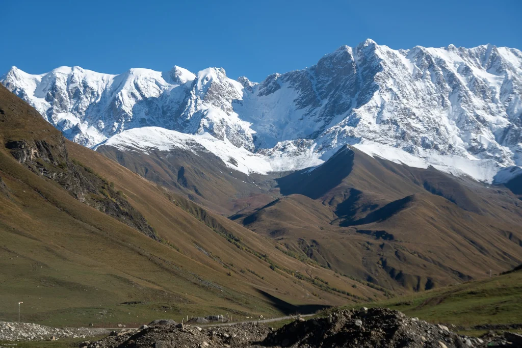 Dramatic snow-covered Caucasus mountain ridge seen from the Svaneti valley.