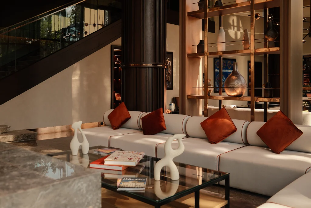ART Riverfront Hotel Tbilisi — Stylish lobby lounge area with sofa seating and decorative accents.