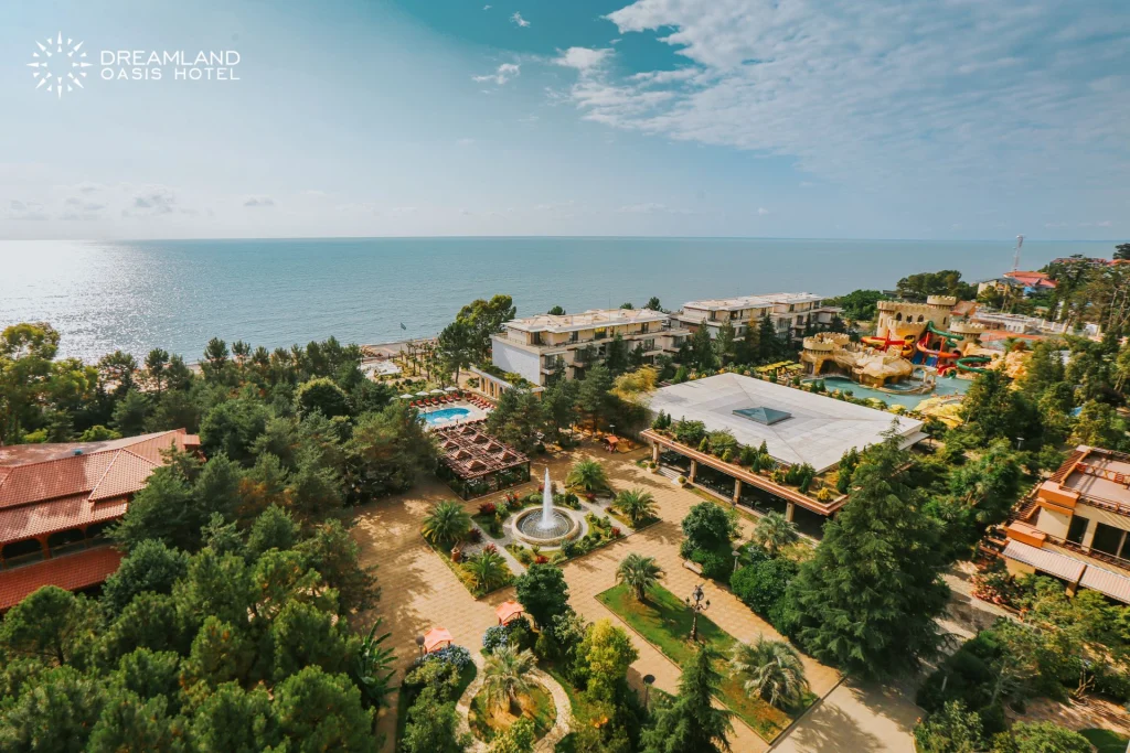 Dreamland Oasis Hotel — Aerial view of the hotel grounds, gardens, and seafront location.