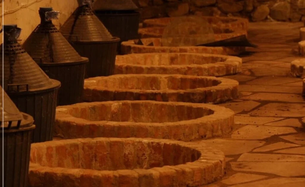 Iora Winery — Traditional underground cellar with round clay vats for winemaking.