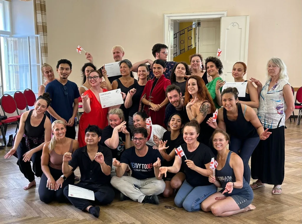 Melita Dance Studio — Group of dance students and instructors pose together in a studio hall.