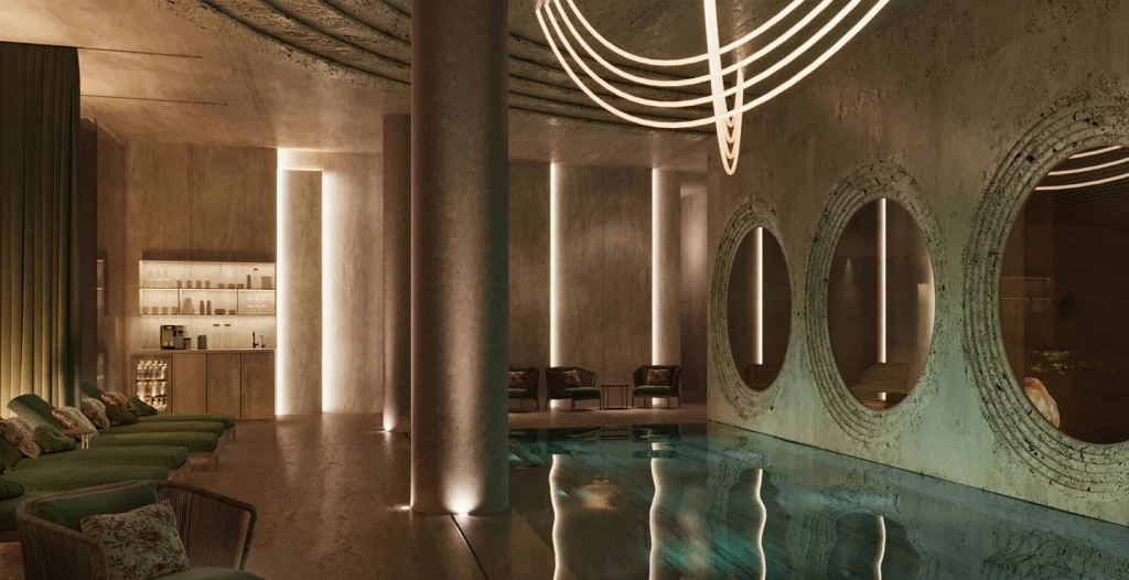Swissôtel Tbilisi — Indoor pool and spa area with ambient lighting, lounge chairs, and circular wall mirrors.