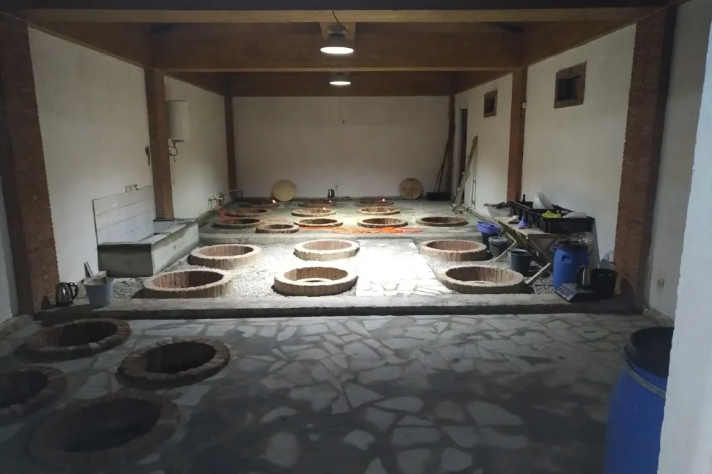 Winilia Winery — Traditional underground clay qvevri wine cellar used for fermenting and aging wine.