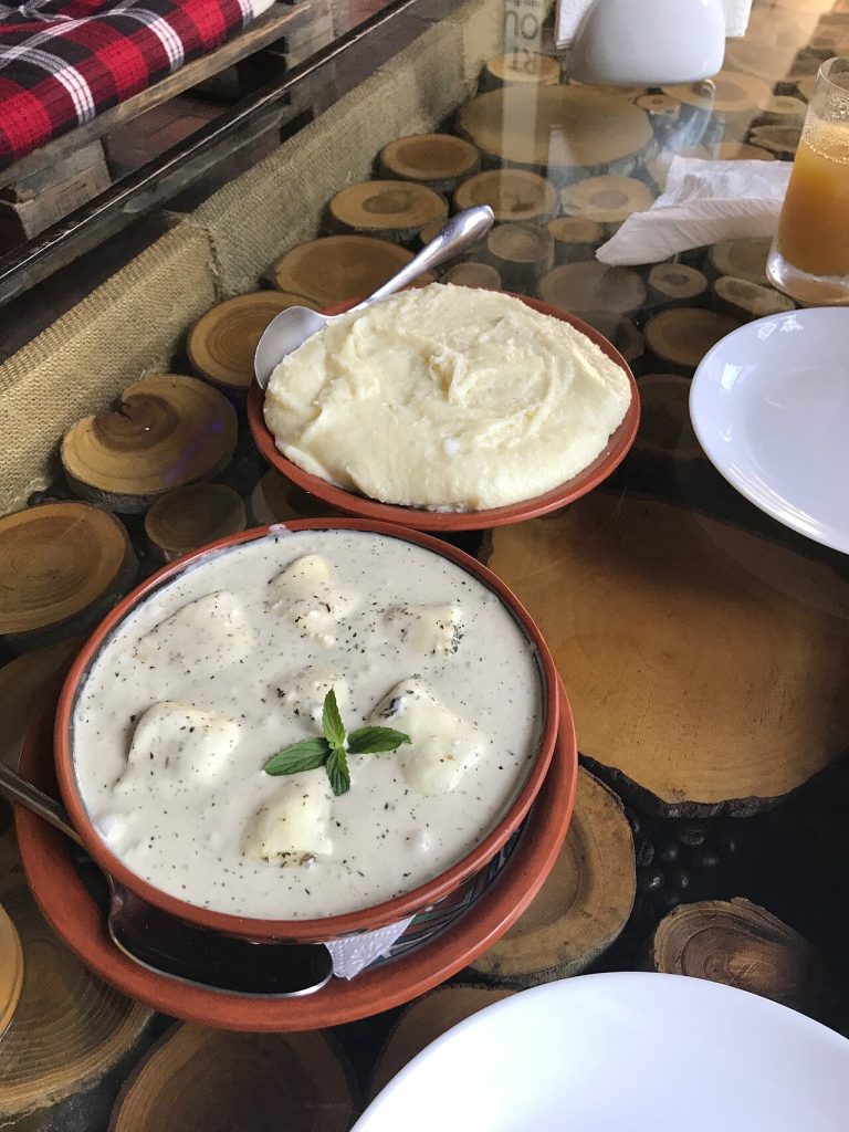 Ghomi cornmeal porridge served with a creamy cheese dish, staples of Samegrelo's table.
