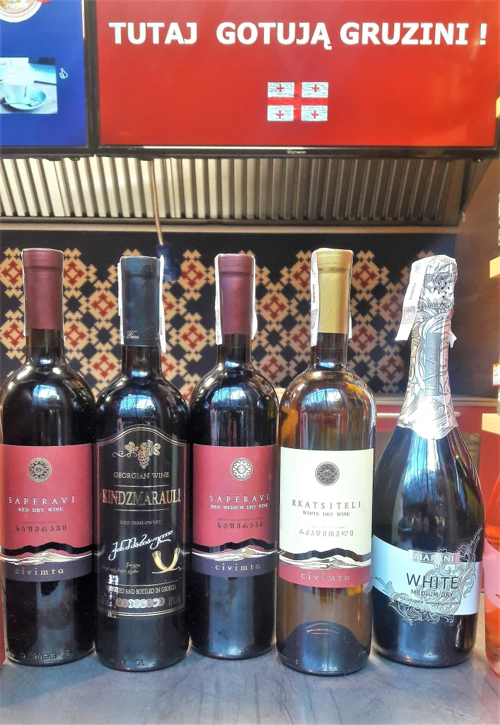 A lineup of Georgian wine bottles showcases native grape varieties like Saperavi and Rkatsiteli.