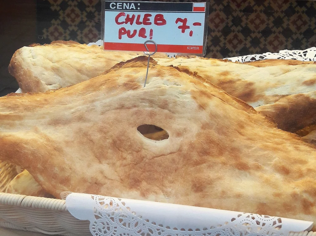 Freshly baked Georgian bread (puri) displayed for sale, typical street food in Georgia.