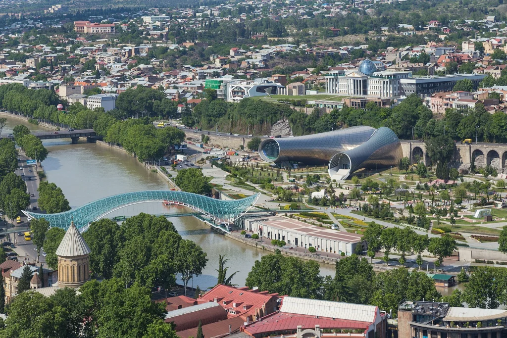 View over Tbilisi from Narikala fortress, with the Peace Bridge and Rike Park.
