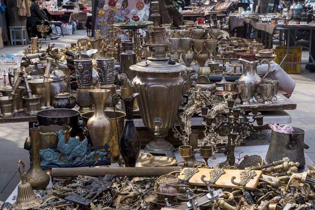 Rows of brass samovars, vases and ornate trinkets at the Dry Bridge Market in Tbilisi.