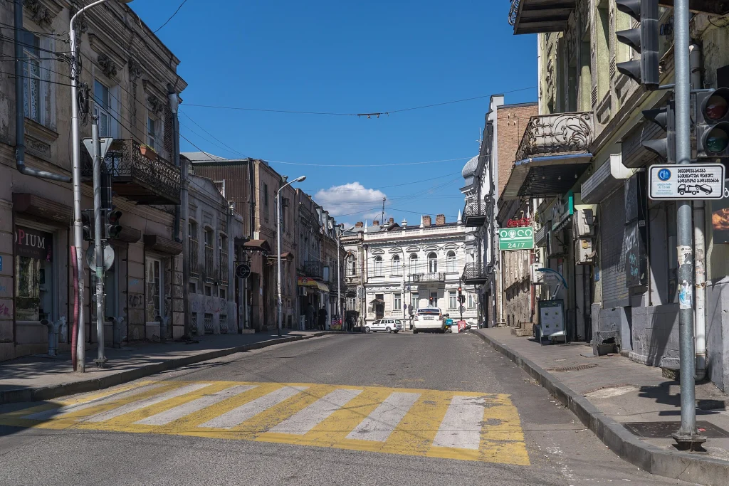 A typical old Tbilisi street scene with historic balconied buildings.