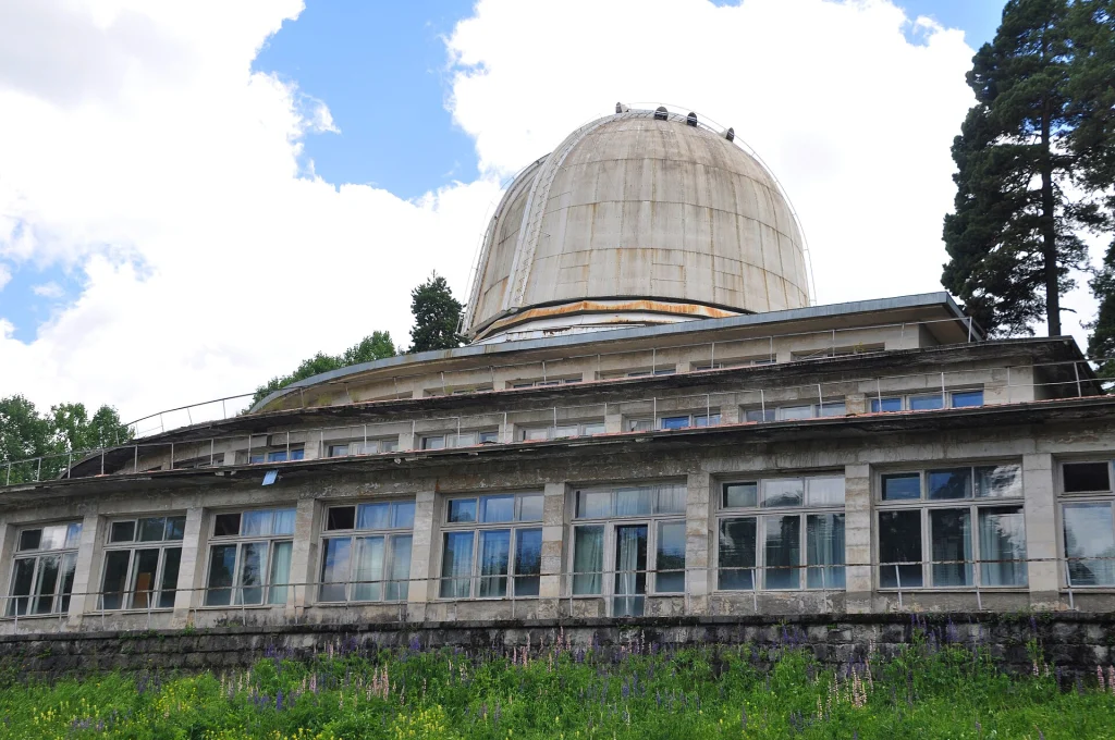 The observatory's large telescope dome rises above its colonnaded building.