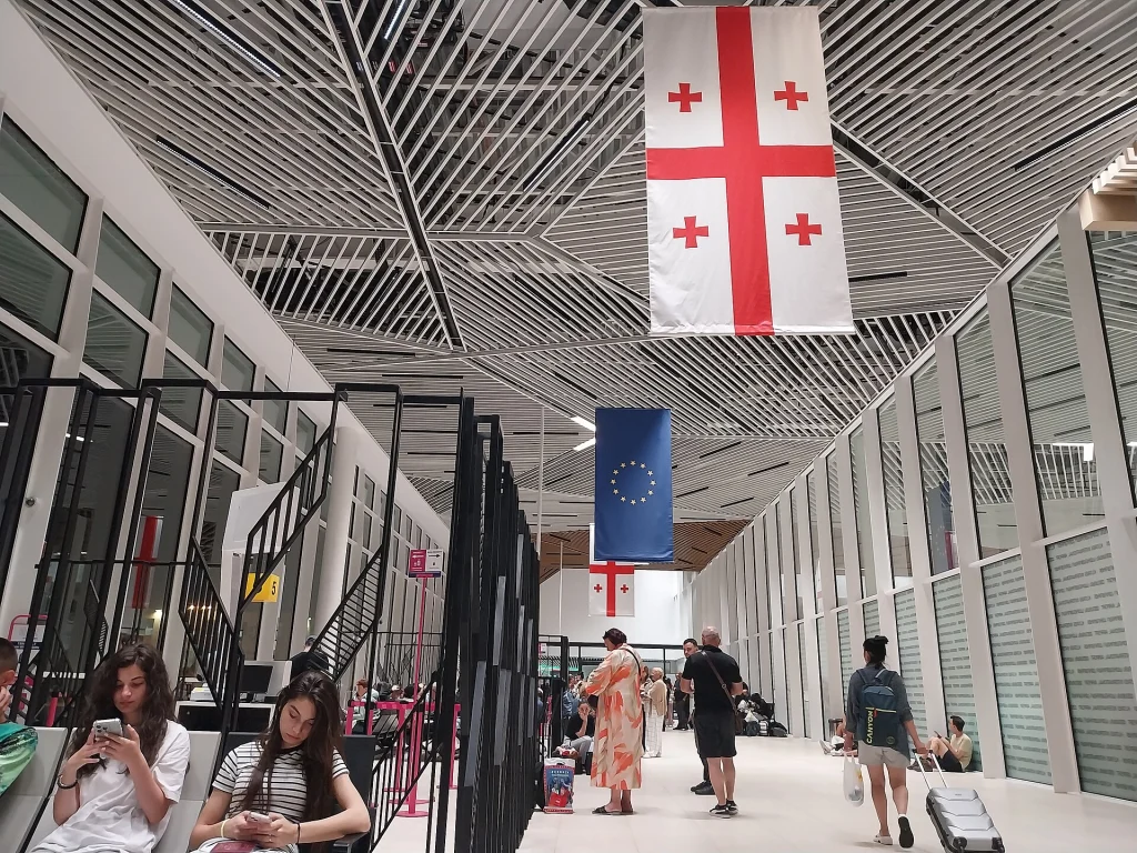 Travellers wait in the modern departure hall of Kutaisi International Airport.