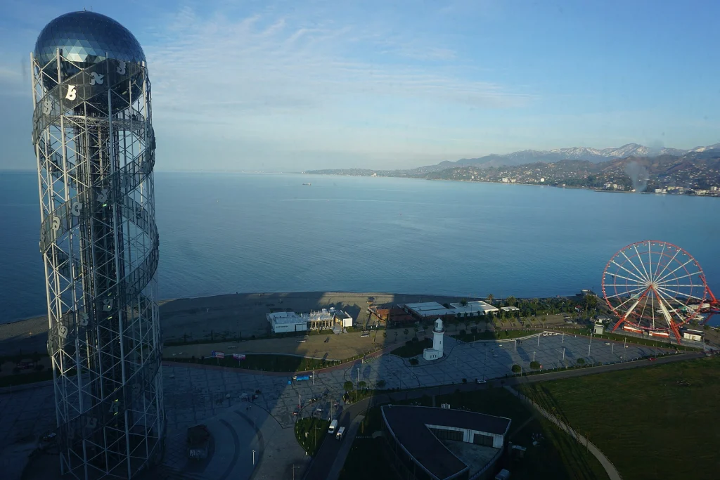 Aerial view of Batumi's seafront with the Alphabet Tower and Black Sea coastline.