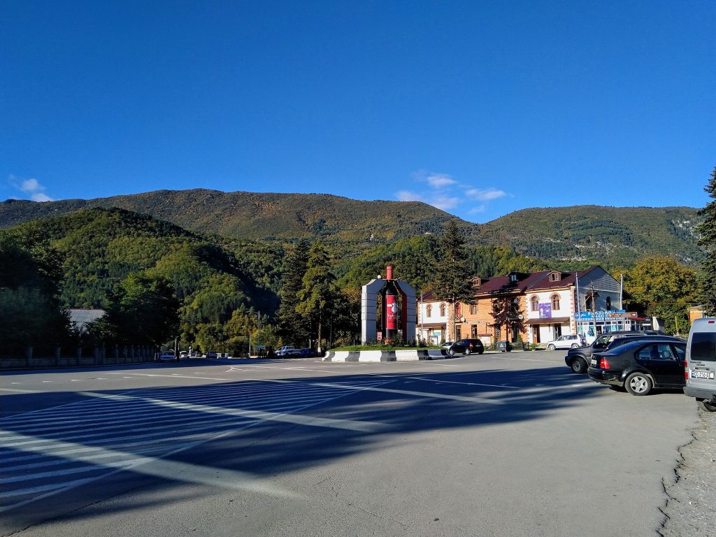 The town center of Ambrolauri, home of the famous Khvanchkara wine, beneath the Racha hills.