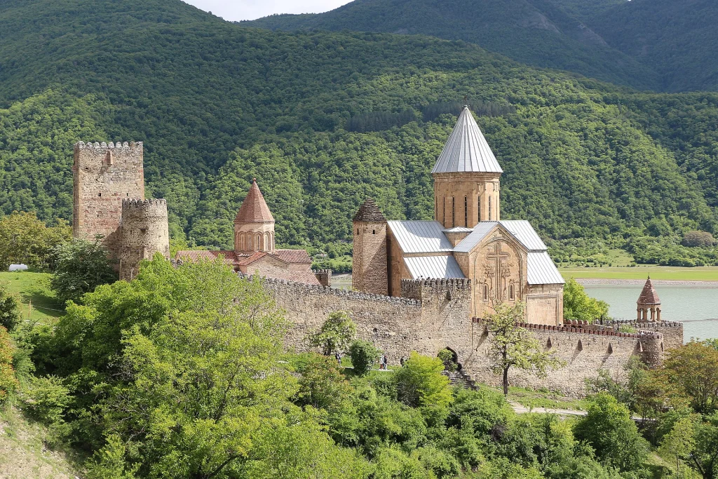 Ananuri fortress complex above the turquoise Aragvi reservoir, a classic stop on the Georgian Military Highway.