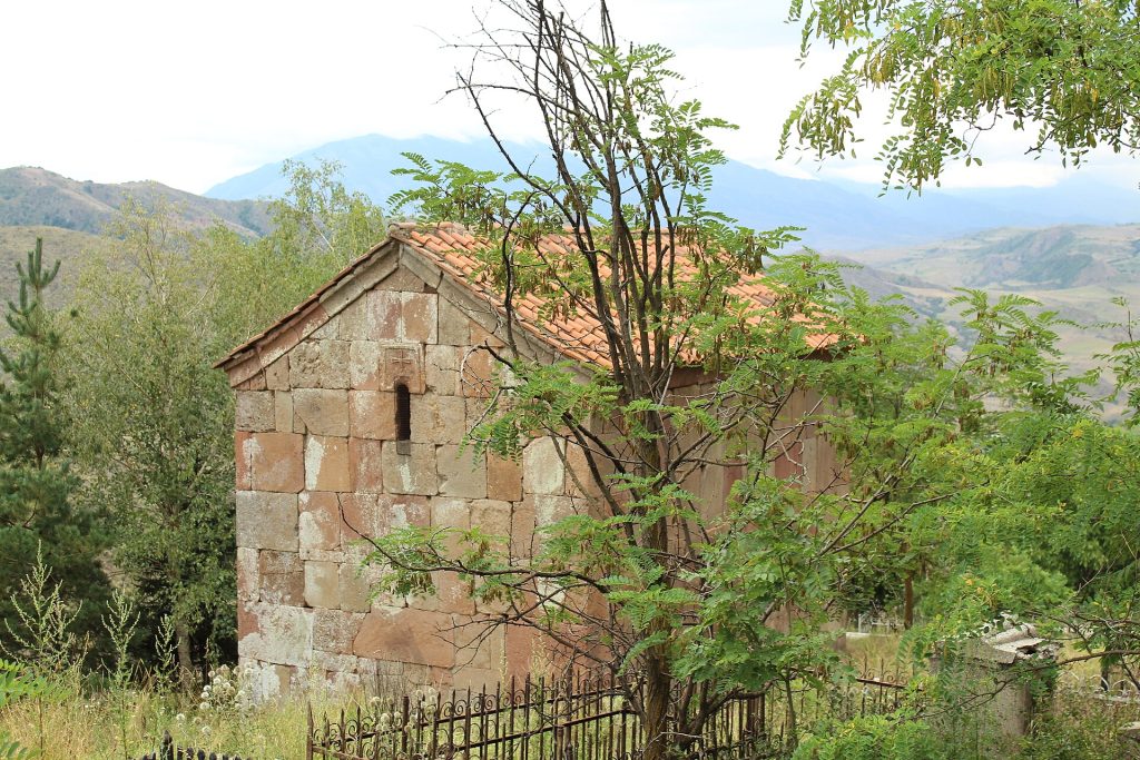 A weathered stone chapel in rural Georgia, part of the country's ancient Andrew-era church heritage.