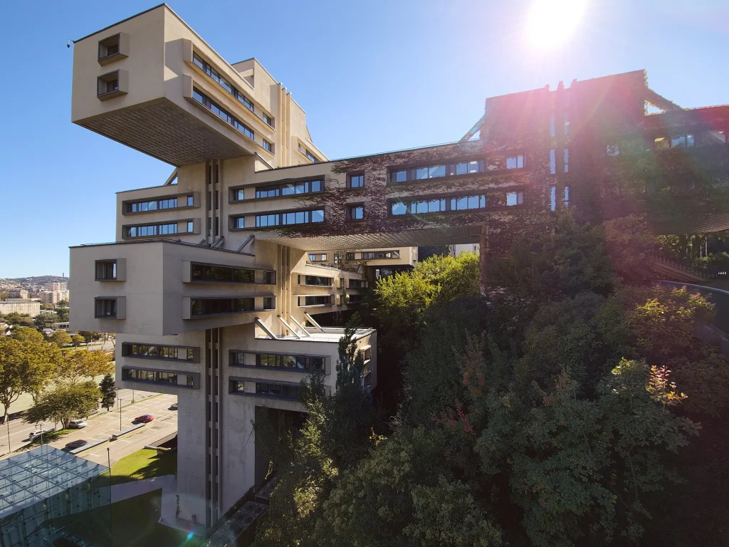 A Brutalist Soviet administrative complex in Tbilisi with cantilevered floors and a skybridge.
