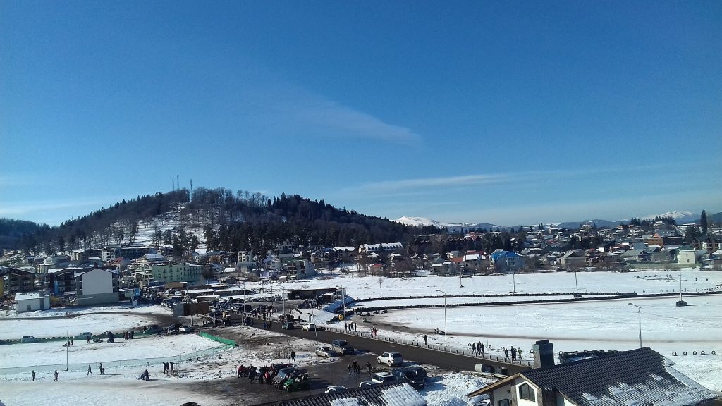 The snow-covered town and ski slopes of Bakuriani during the height of winter season.