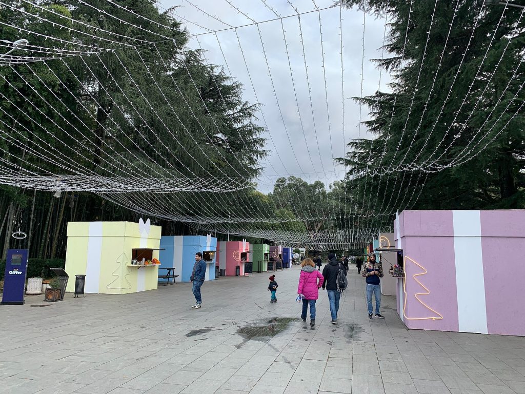 Festive stalls and lights line the path near Europe Square during Batumi's New Year season.