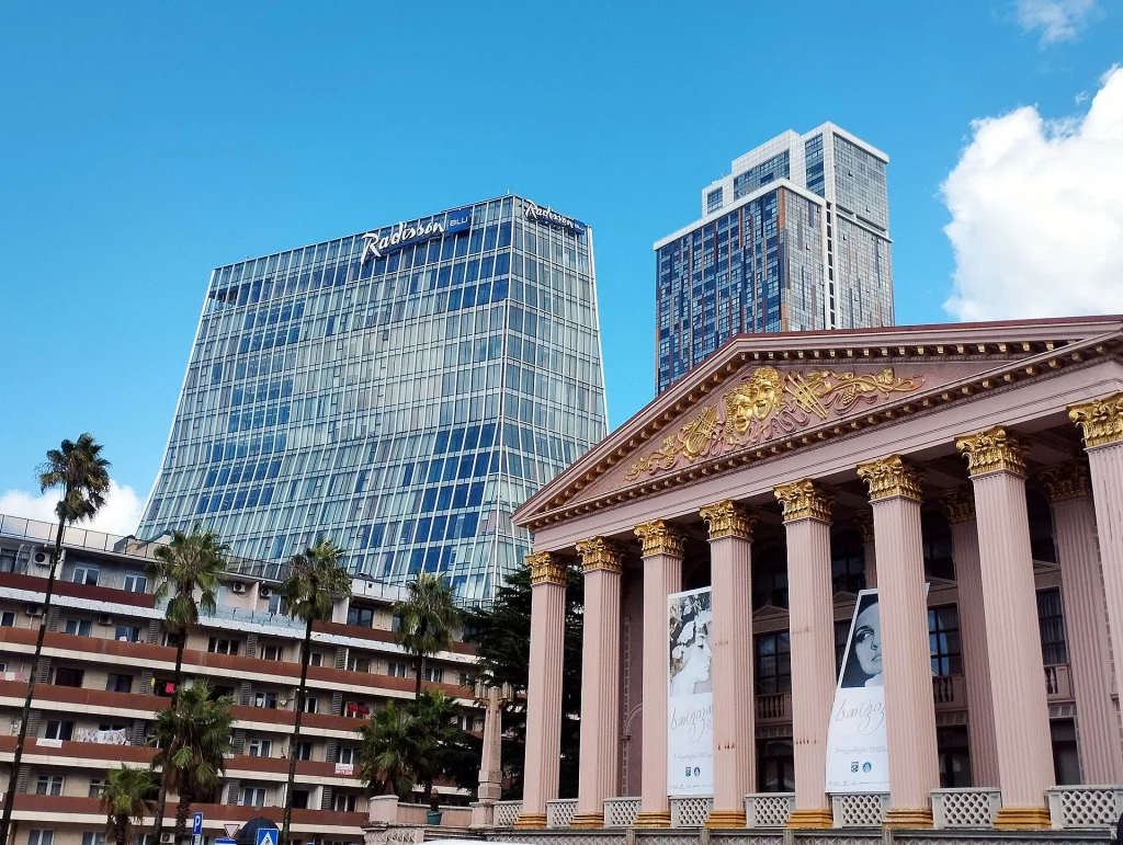 Batumi's Radisson tower and historic theatre highlight the city's hotel and conference infrastructure.