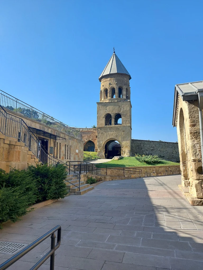 The 15th–16th-century stone bell tower stands within the Samtavro Monastery complex.