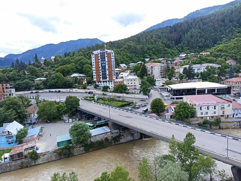 Aerial view of Borjomi town with the Mtkvari River and surrounding hills.