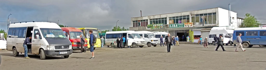 Passengers and minibuses crowd the bus station in Gori, a typical marshrutka hub.