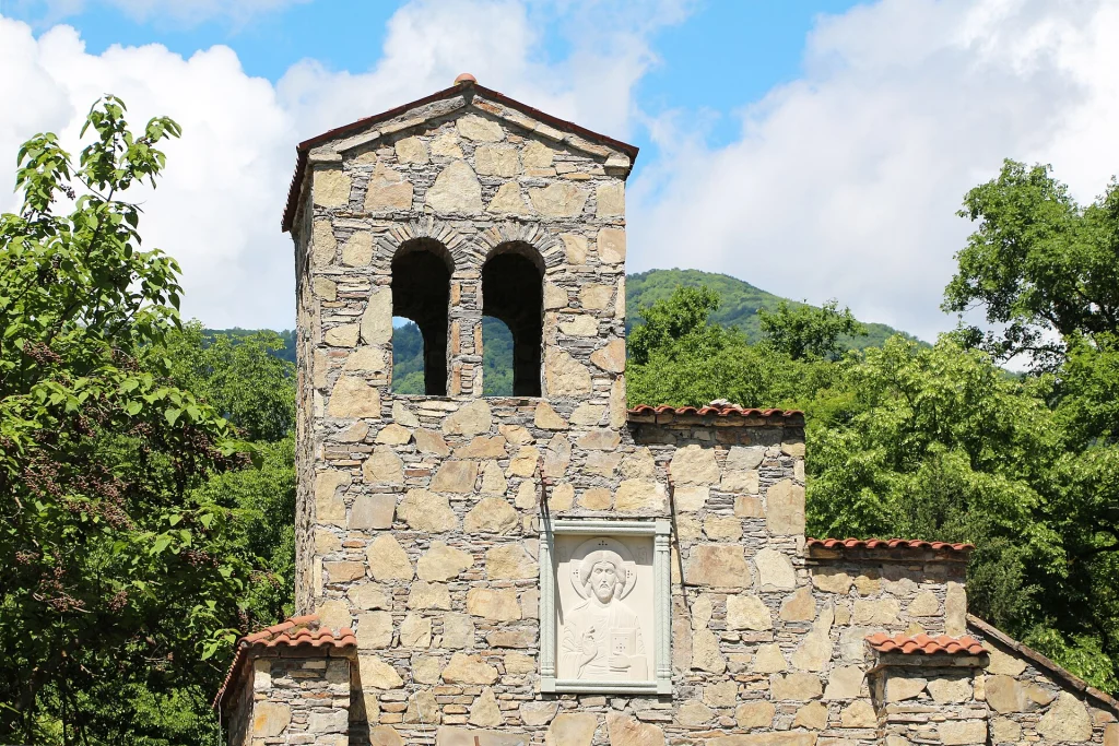 Close view of a stone church tower with arched windows near Nekresi monastery, Georgia.