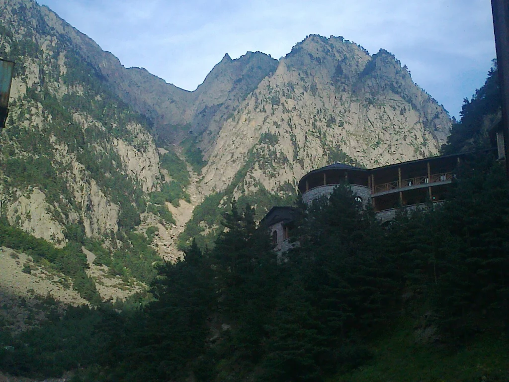 Steep rock walls tower over the Catholicos-Patriarch's residence deep within Dariali Gorge.