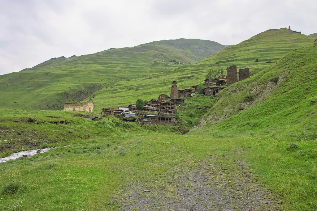 The medieval tower village of Dartlo nestled among green Tusheti hills.