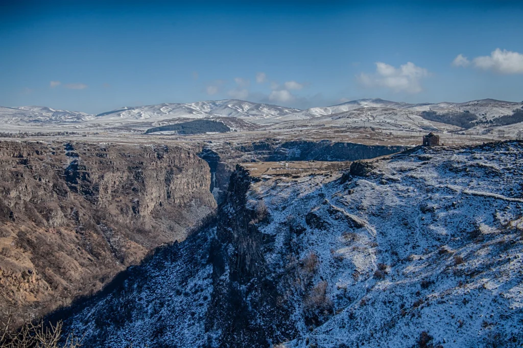 A snow-dusted aerial view of Dashbashi Canyon slicing through the Tsalka plateau.