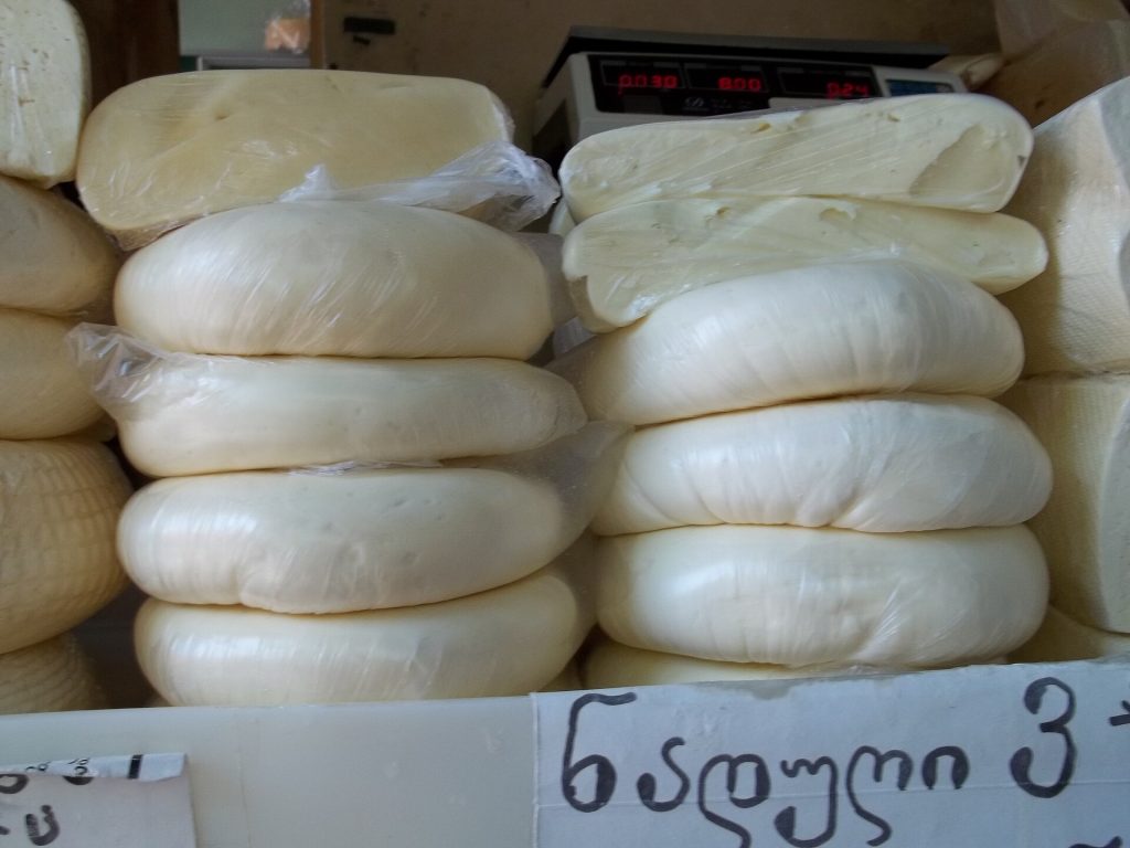 Stacked discs of sulguni, a traditional Georgian cheese featured at the festival.