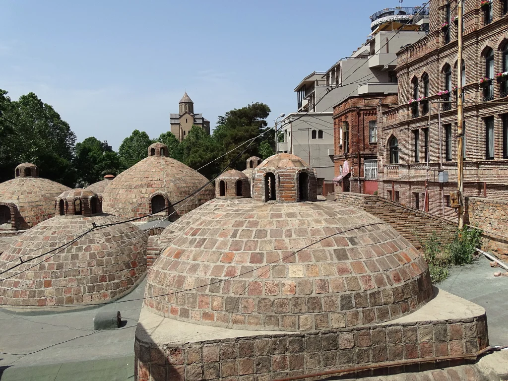 Brick domes of the Royal Bath rise above Tbilisi's historic Old Town district.