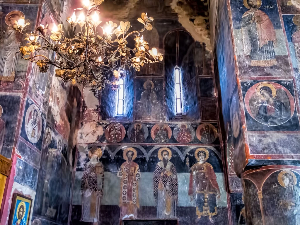 Vivid 16th-century frescoes cover the walls of the Church of the Archangels inside Gremi citadel.