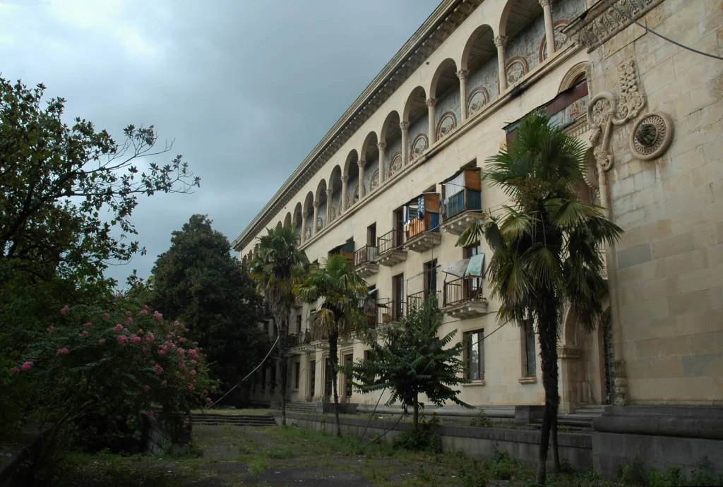 A grand Soviet-era sanatorium stands abandoned amid overgrown gardens in the spa town of Tskaltubo.