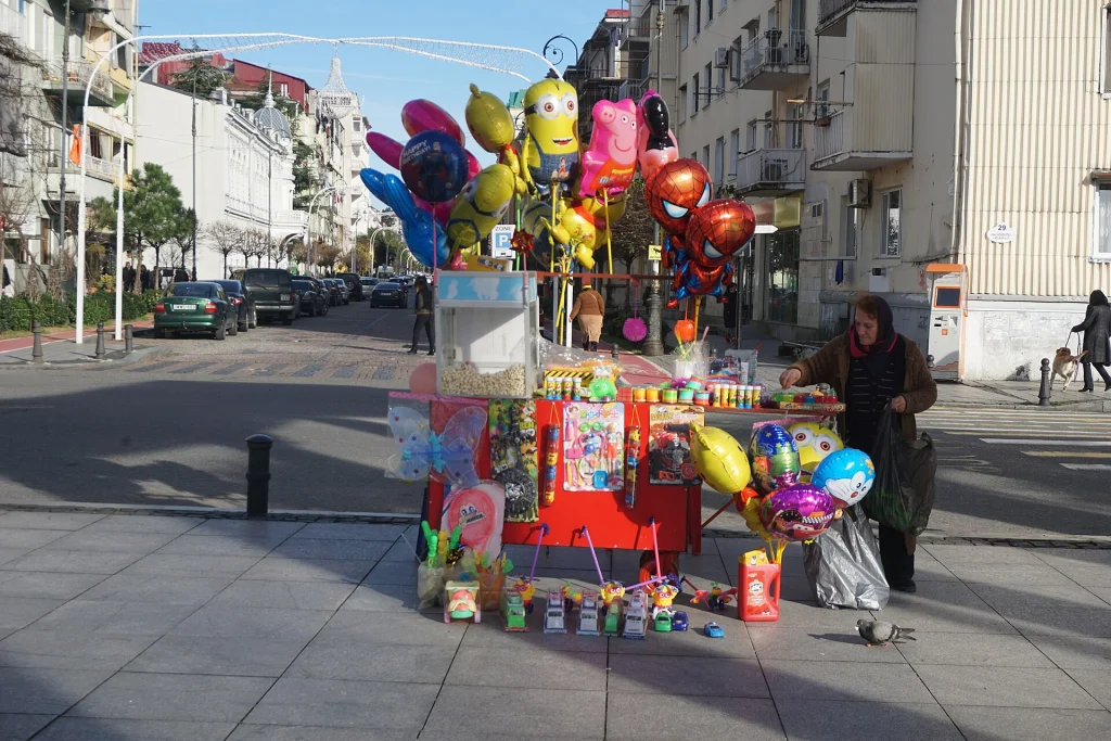 A street vendor selling balloons and popcorn on a Batumi street, Georgia.