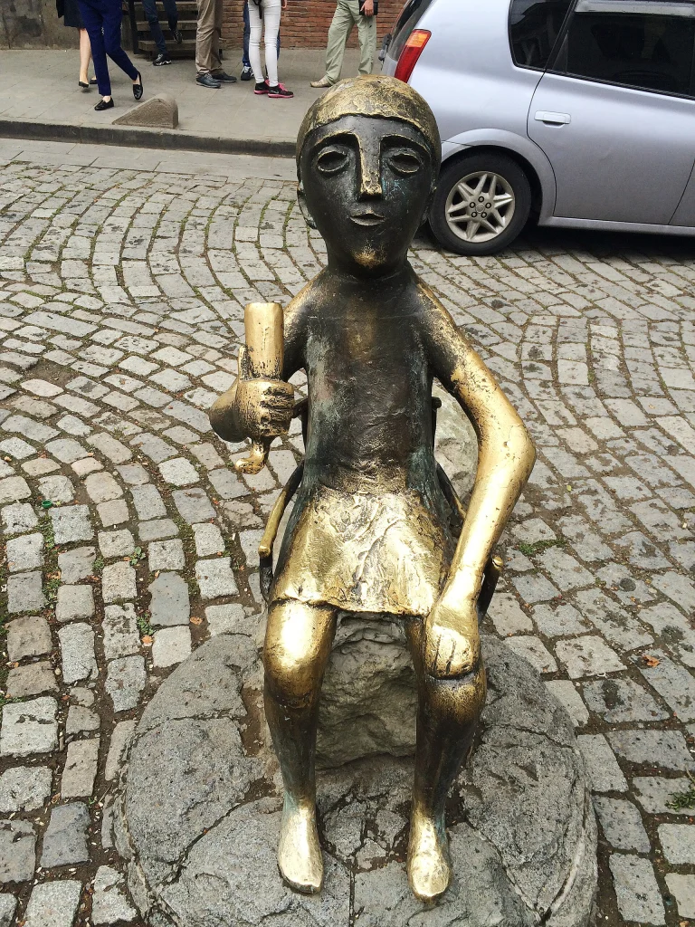 Bronze statue of a tamada, the toastmaster who leads a Georgian supra, in Tbilisi's old town.