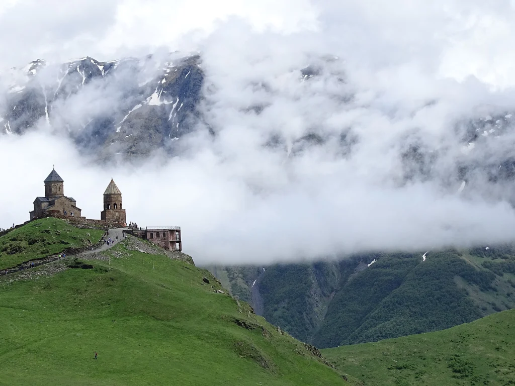 Gergeti Trinity Church perched on a hill near Kazbegi, a classic day-trip from Tbilisi for travellers.