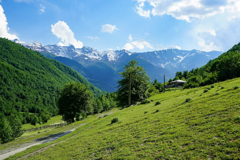 Snow-capped Caucasus peaks near Svaneti illustrate the mountain scenery travellers from Laos can expect.