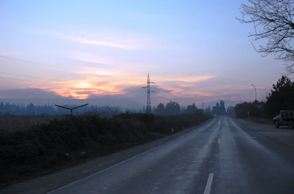 Sunset glow over a quiet rural road in Kakheti, Georgia.