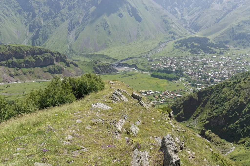 View over Stepantsminda (Kazbegi) and the Gergeti valley from the surrounding mountains.