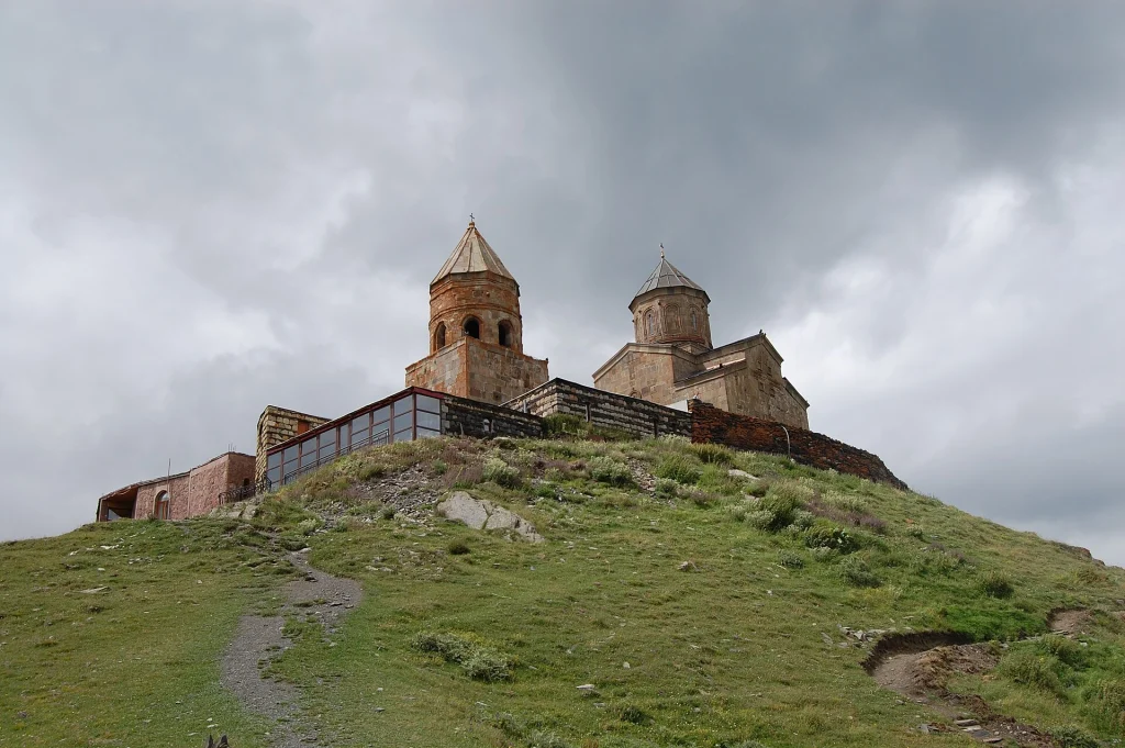 Gergeti Trinity Church perched on its hilltop above Kazbegi, Georgia.