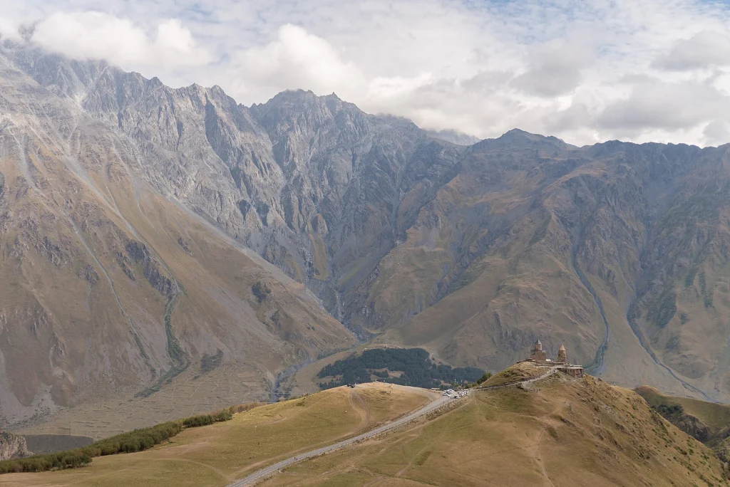 Gergeti Trinity Church beneath the Caucasus peaks, a classic day-trip from Tbilisi.