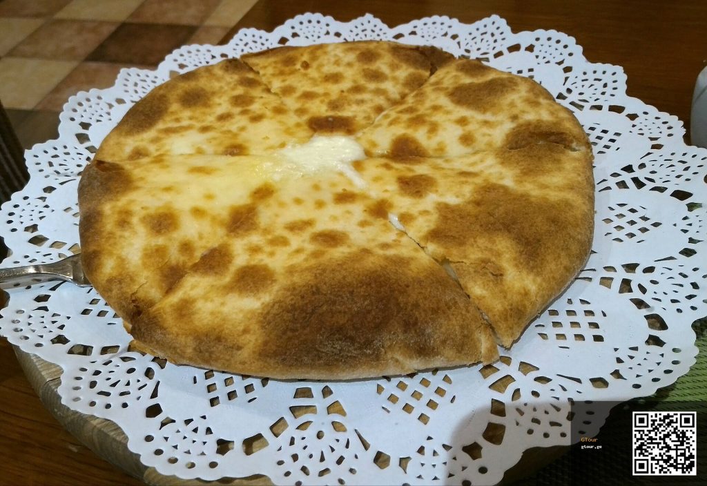 Imeretian khachapuri, the classic round cheese-filled bread celebrated on Khachapuri Day.