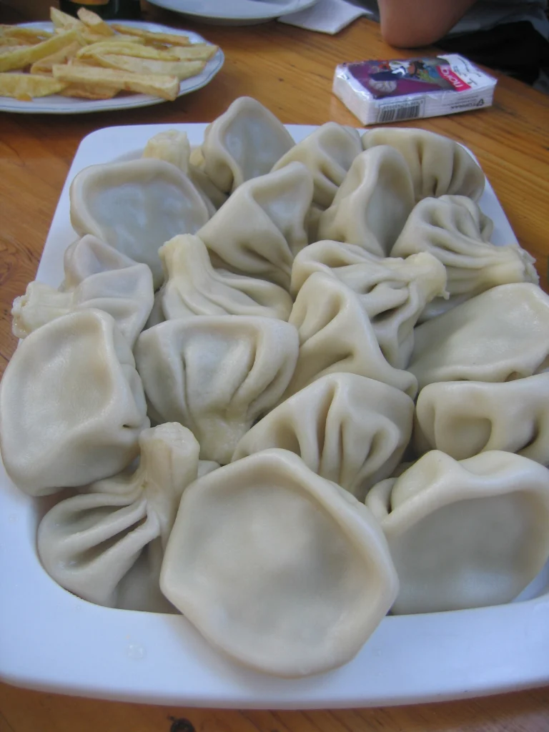 A plate of khinkali, Georgia's iconic dumplings, a must-try dish for visitors.