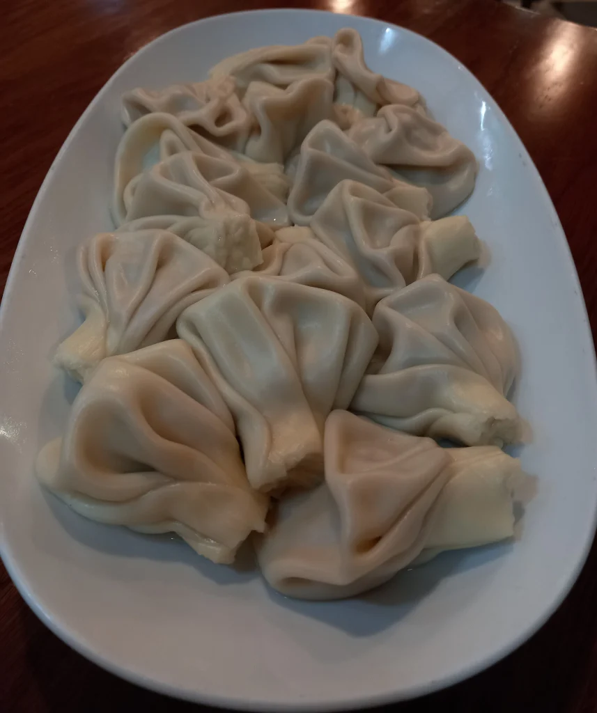 A plate of khinkali, Georgia's iconic dumpling, a must-try dish for visiting Italians.
