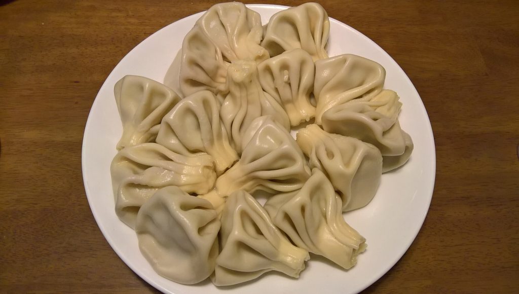 A plate of khinkali dumplings, a classic dish served at the Racha festival.