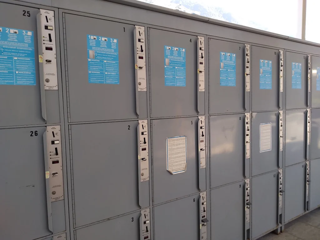 Self-service luggage lockers typical of the pay-per-use storage systems used by travelers at stations and city centers.