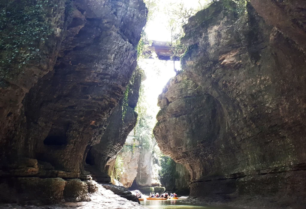 Visitors boating through Martvili Canyon, a popular natural attraction for travellers in Georgia.