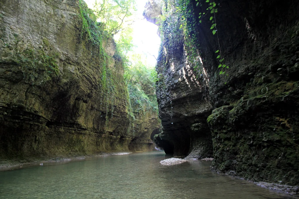 Boat trip through the narrow rock walls of Martvili Canyon on the Abasha River.